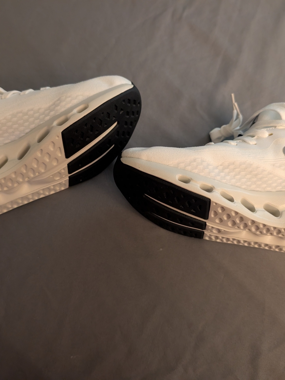 New white Athletic Sneakers with Black Outsole Accents. Never worn.